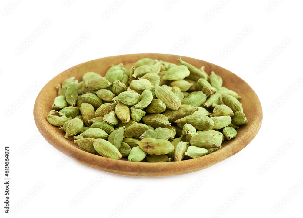 pile of green cardamom cardamon in wood plate isolated on white background. green cardamom cardamon isolated. heap of green cardamom cardamon isolated pile of green cardamom cardamon in wood plate isolated on white background. green cardamom cardamon isolated. heap of green cardamom cardamon isolated