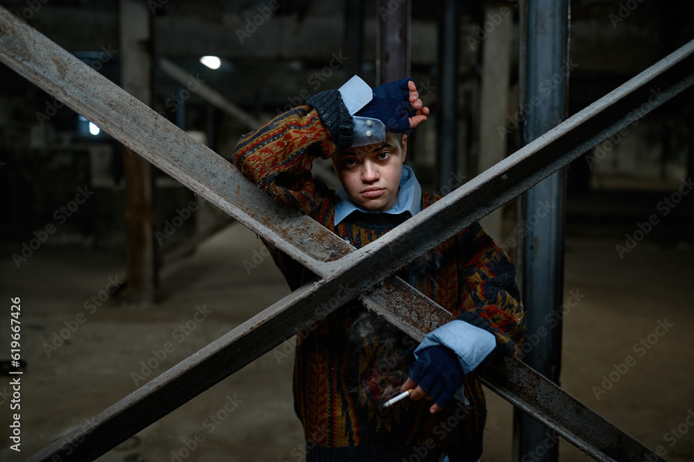 Portrait of teenage hipster girl refugee or beggar in abandoned building Portrait of teenage hipster girl refugee or beggar in abandoned building