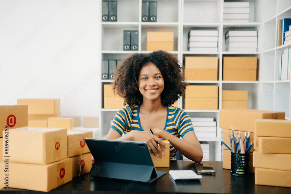Small business entrepreneur SME freelance woman working at home office, BOX,tablet and laptop online, marketing, packaging, delivery, e-commerce concept. Small business entrepreneur SME freelance woman working at home office, BOX,tablet and laptop online, marketing, packaging, delivery, e-commerce concept.