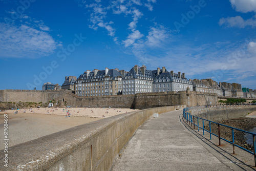 St Malo, France. View over the walled city Saint-Malo medieval pirate fortress, St Vincent Cathedral and lighthouse from the sea in Summer Daytime, Brittany