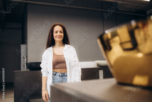 Female sales person at shop with baths