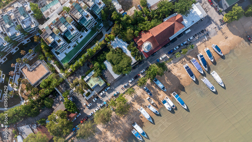 Aerial view beach. Lot of speed boats anchored waiting for trourist at the Chalong bay in Phuket, Thailand. photo