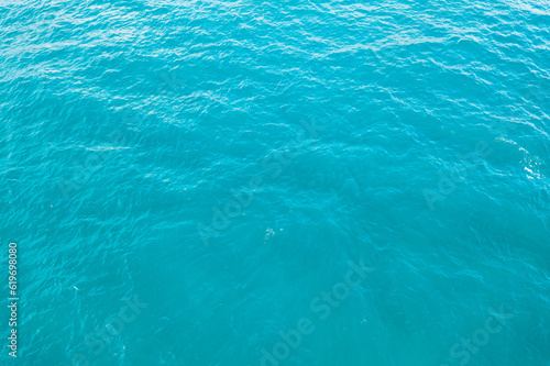 blue ocean waves background. Water surface on ocean. copy space area for text. Reflection on the surface of the ocean on a calm day.