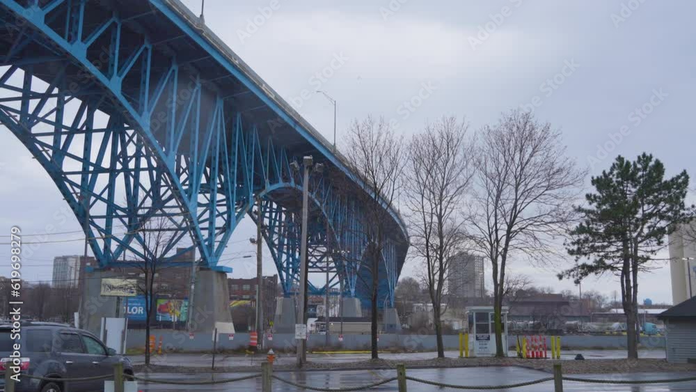 panning shot of blue bridge, main avenue bridge, Burton memorial bridge in Cleveland, Ohio near Lake Erie in the Flats panning shot of blue bridge, main avenue bridge, Burton memorial bridge in Cleveland, Ohio near Lake Erie in the Flats