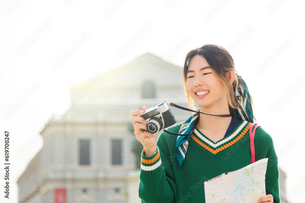 Joyful tourist capturing memories in historic city. Joyful tourist capturing memories in historic city.
