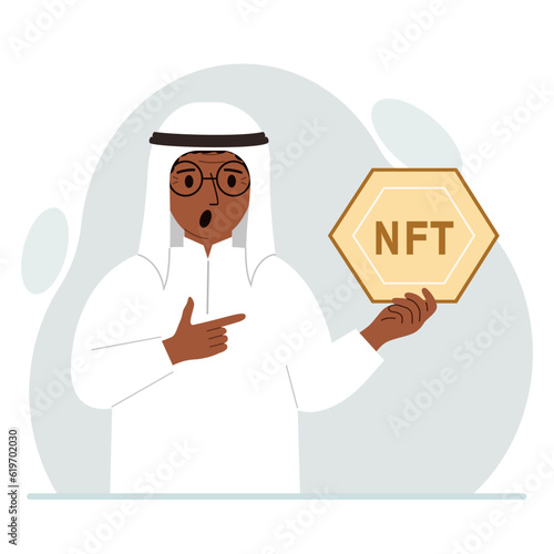 NFT concept. The muslim man is holding nft in his hand. Works of art using non-fungible tokens for auctions, sale and purchase of works of art.
