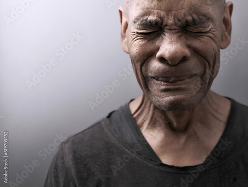 men crying in desperation with people stock photo on grey ackground
