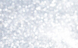 Abstract blurred shiny silver bokeh background, white bokeh on grey background