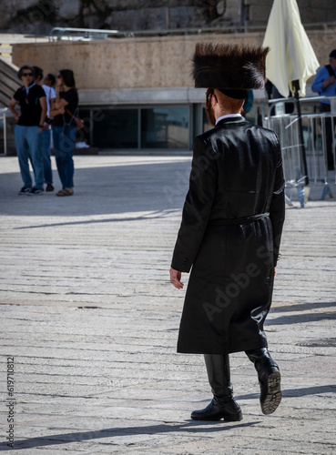 People pray and walking along Western Wall in Jerusalem, Israel