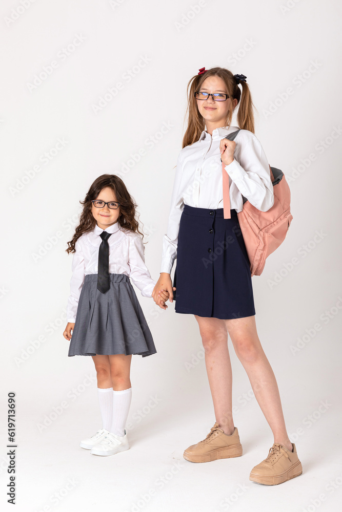 Portrait of Schoolgirls on white background. Back to school concept