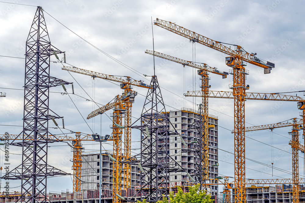 Construction of a multi-storey residential building on a summer day Construction of a multi-storey residential building on a summer day