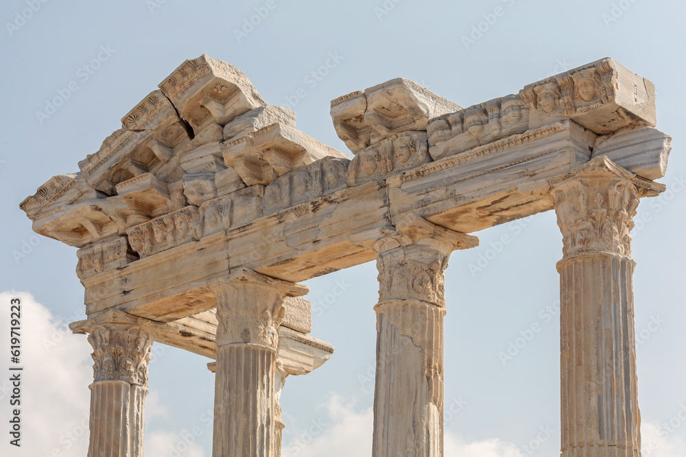 Temple of Apollo in Side (Turkey). Marble entablature of the ruined temple. Stone-cut masks relief on the frieze. History, art or architecture concept