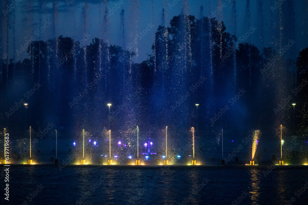 Fountain laser show. Evening performance of singing fountains.