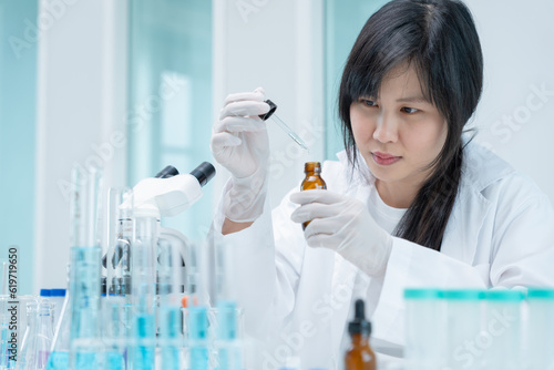 Scientist analyze biochemical samples in advanced scientific laboratory. Research and development staff use dropper mix microbiological developmental of perfume. Biotechnology research in science lab