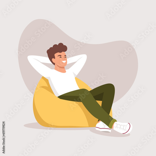 a man sleeps (rests) in a bean bag chair
