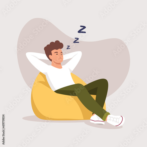 a man sleeps (rests) in a bean bag chair