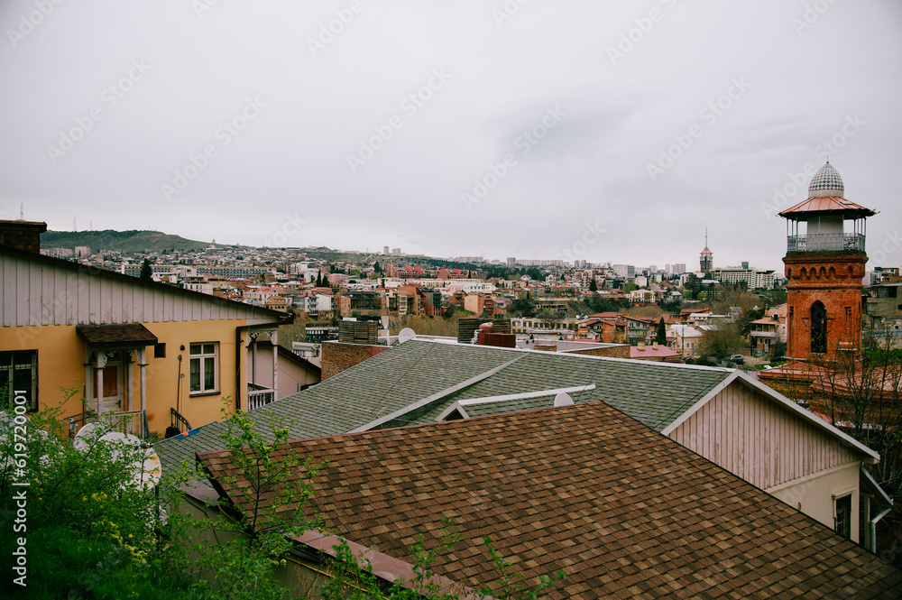 rooftops of city houses with a marvelous sky