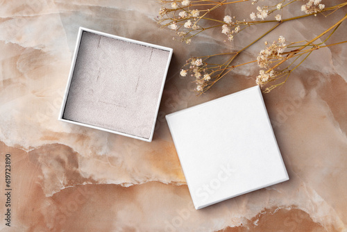 фотографія White jewelry box on a white marble background