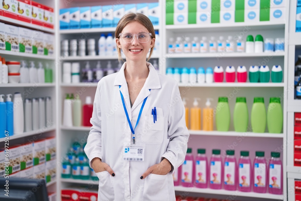 Young blonde woman pharmacist smiling confident standing at pharmacy Young blonde woman pharmacist smiling confident standing at pharmacy