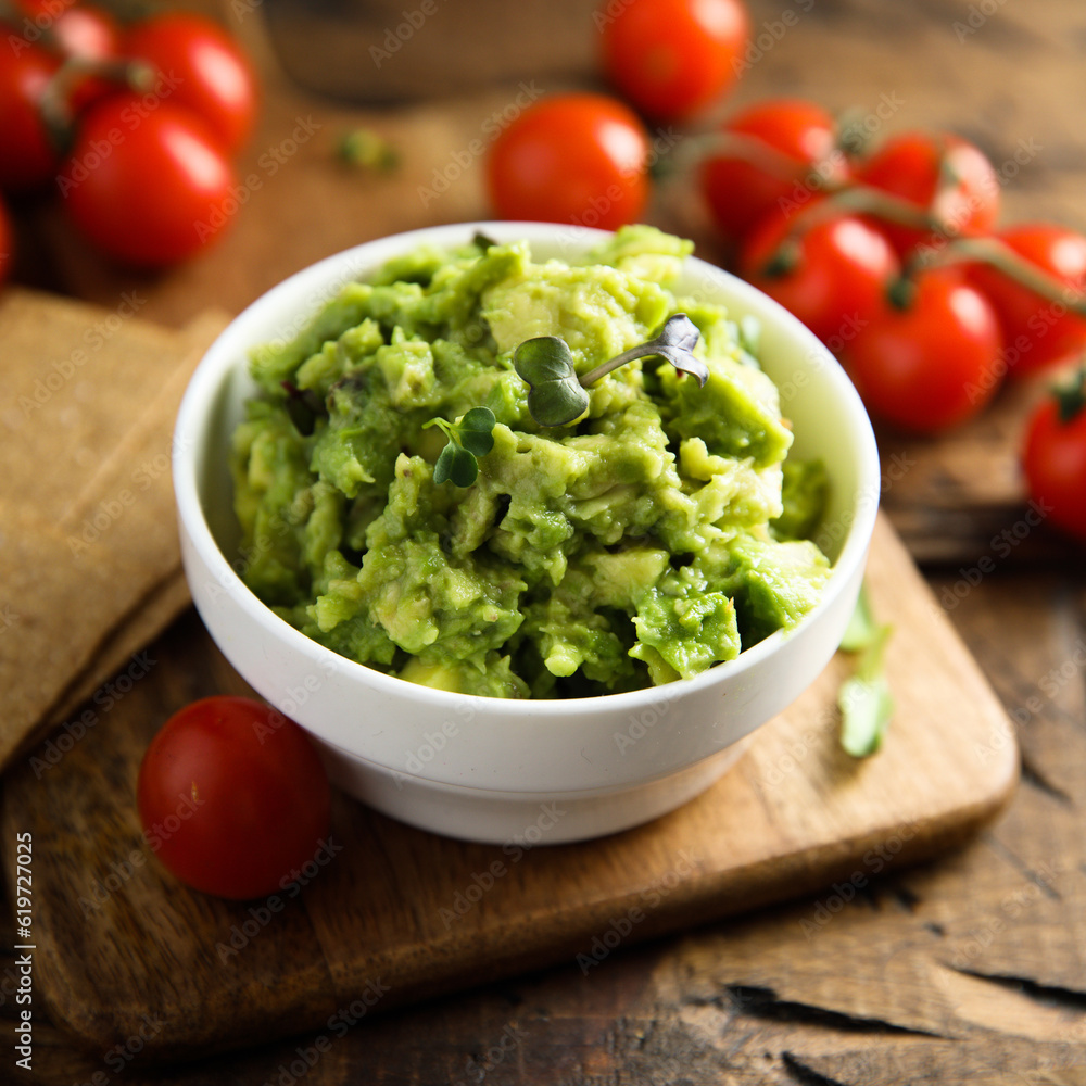 Homemade avocado dip with ripe tomatoes Homemade avocado dip with ripe tomatoes