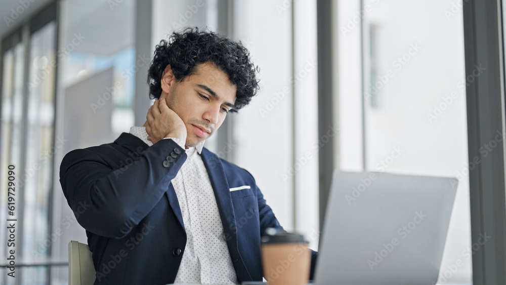 Young latin man business worker using laptop stressed at office Young latin man business worker using laptop stressed at office