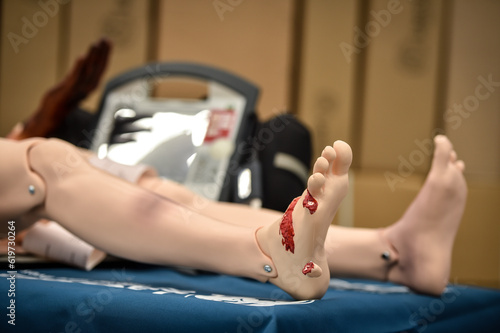 Photography Paramedics simulate emergency intervention on medical training manikin