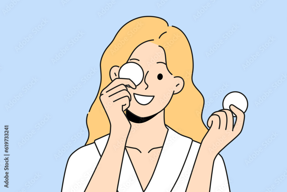 Woman with cotton pads for removing makeup and mascara with lipstick smiling getting ready for bed. Beautiful girl uses cotton pads for cosmetic purposes, wanting to impress boyfriend Woman with cotton pads for removing makeup and mascara with lipstick smiling getting ready for bed. Beautiful girl uses cotton pads for cosmetic purposes, wanting to impress boyfriend