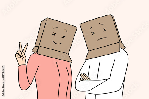 People with cardboard boxes on heads look at screen with sad or cheerful emotions. Man and woman pose with fake mood and show different emotions hiding true psychological or mental state.