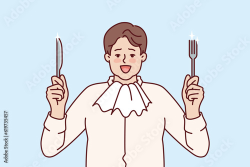 Fat man with napkin around neck holds fork and knife and prepares for hearty dinner and eating. Funny hungry guy rejoices at opportunity to eat food for concept of overeating and fighting obesity