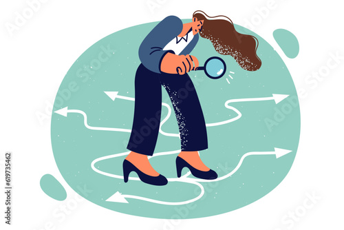 Business woman using magnifying glass standing near arrows symbolizing options for solving problem