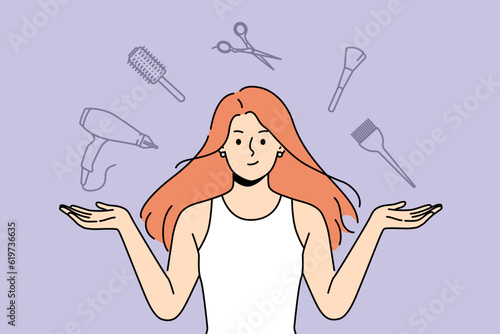 Woman stylist with flying accessories for hairdresser offers to make new hairstyle to change image. Girl hairdresser from beauty salon recommends taking care of hair and using professional equipment