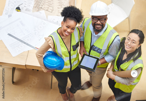 Tablet, teamwork or portrait of engineers with designer planning a construction for architecture. Top view, blueprint or happy black people with Asian woman meeting together on a development project