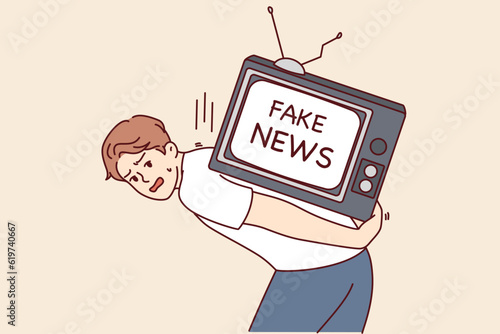 Man suffering from fake news on TV for concept of fighting disinformation and propaganda in media. Guy with big televisor on back is stressed out by fake news from journalists and yellow press.