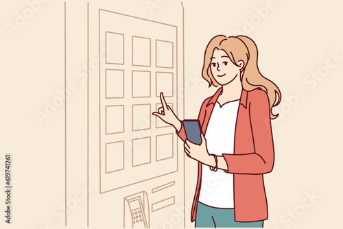 Woman orders food at fast food restaurant using terminal with cashless payment function. Girl cafe visitor uses terminal with digital menu to buy dish likes for concept innovation in HoReCa business