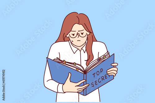 Woman is studying secret documents holding folder of papers in hand and working with confidential data. Businesswoman has access to classified information reads information prohibited for distribution