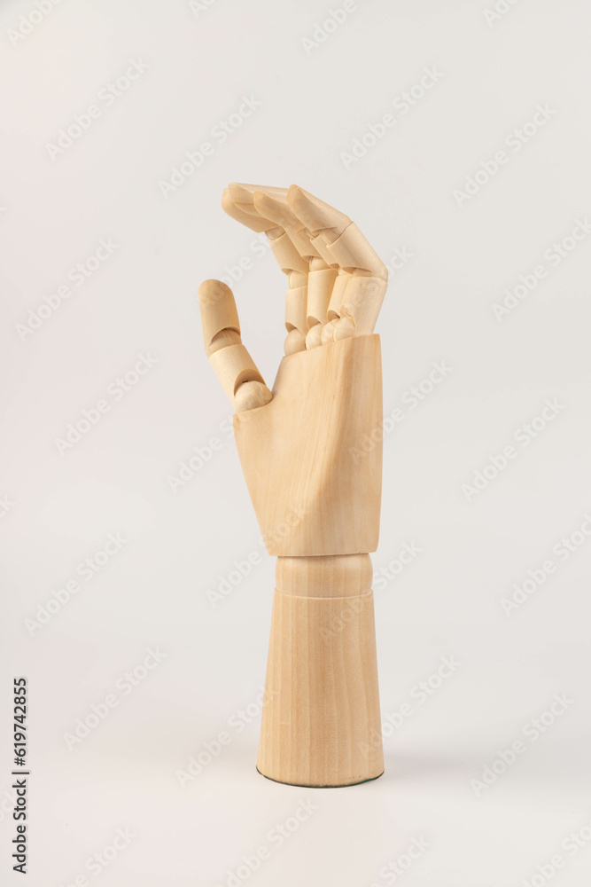 Wooden hand isolated on a white background. Copy space Wooden hand isolated on a white background. Copy space