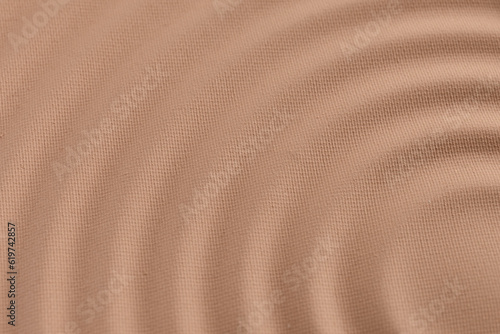 Bronzer or blusher and compact powder brown nude smudge textured background