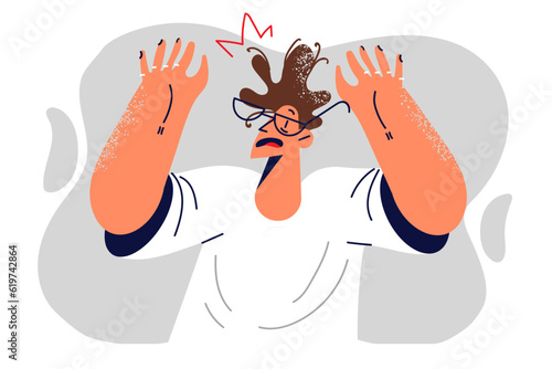 Frightened man victim raises hands in surrender and refusing to resist during threats or robbery