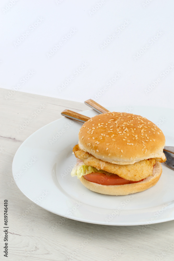 Chicken burger with lettuce and tomato Chicken burger with lettuce and tomato