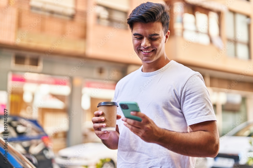 Young hispanic man using smartphone drinking coffee at street Young hispanic man using smartphone drinking coffee at street