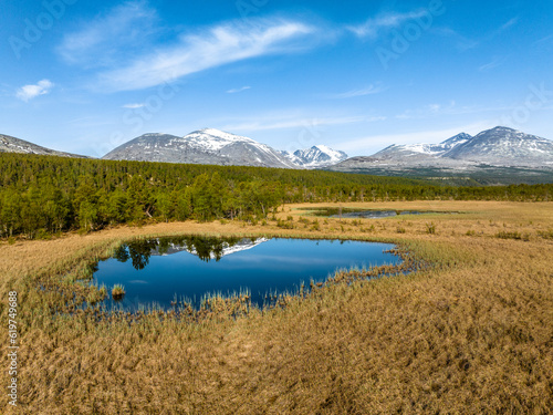 Beautiful landscape of Rondane National Park with reflection on a pond