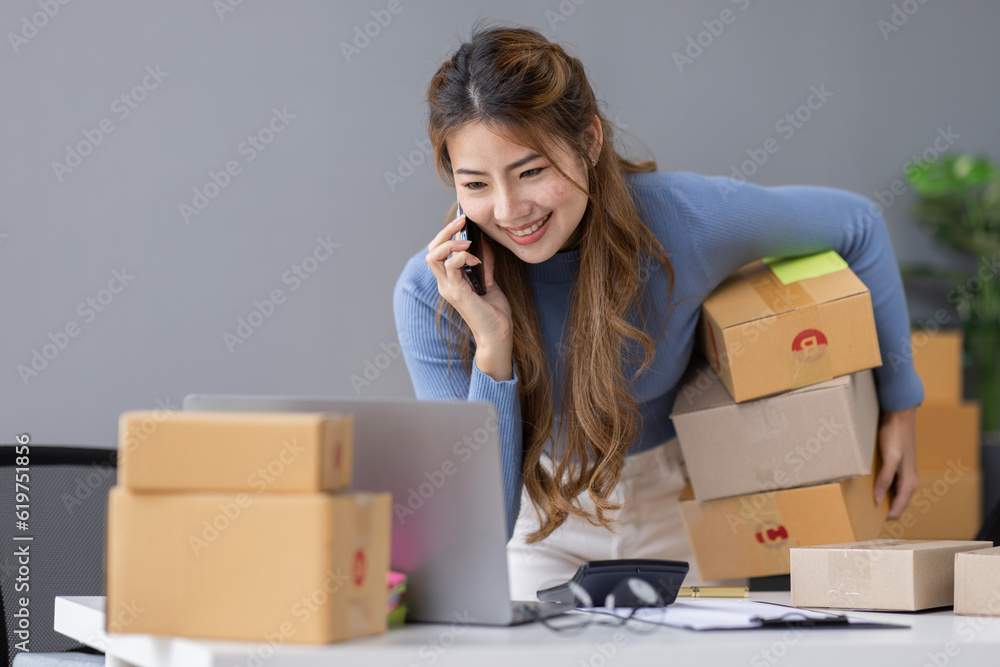 Portrait of asian young freelancer small business startup, SME owner, asian female entrepreneur work and check orders online at home. online SME business idea. Portrait of asian young freelancer small business startup, SME owner, asian female entrepreneur work and check orders online at home. online SME business idea.