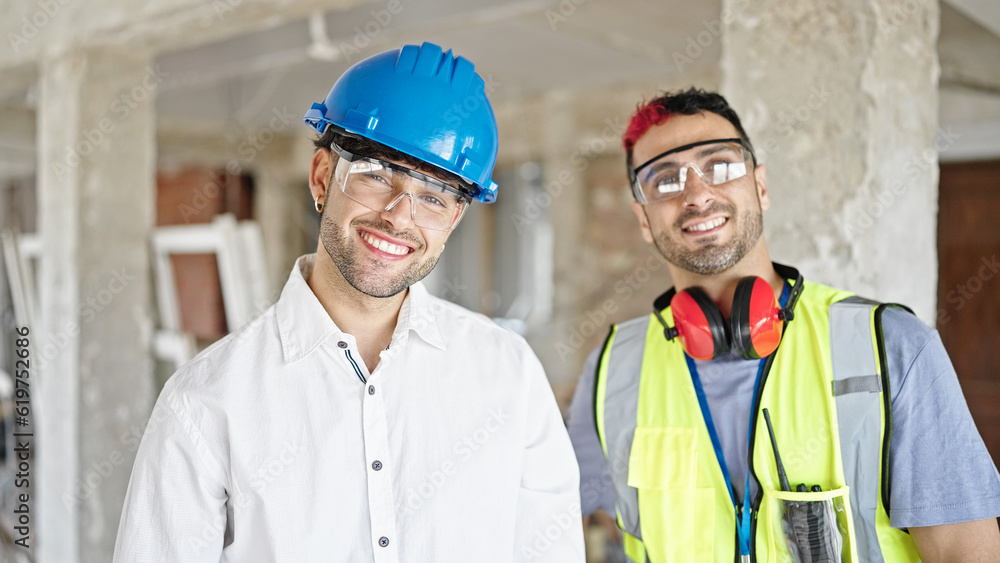 Two men builder and architect smiling confident standing together at construction site Two men builder and architect smiling confident standing together at construction site