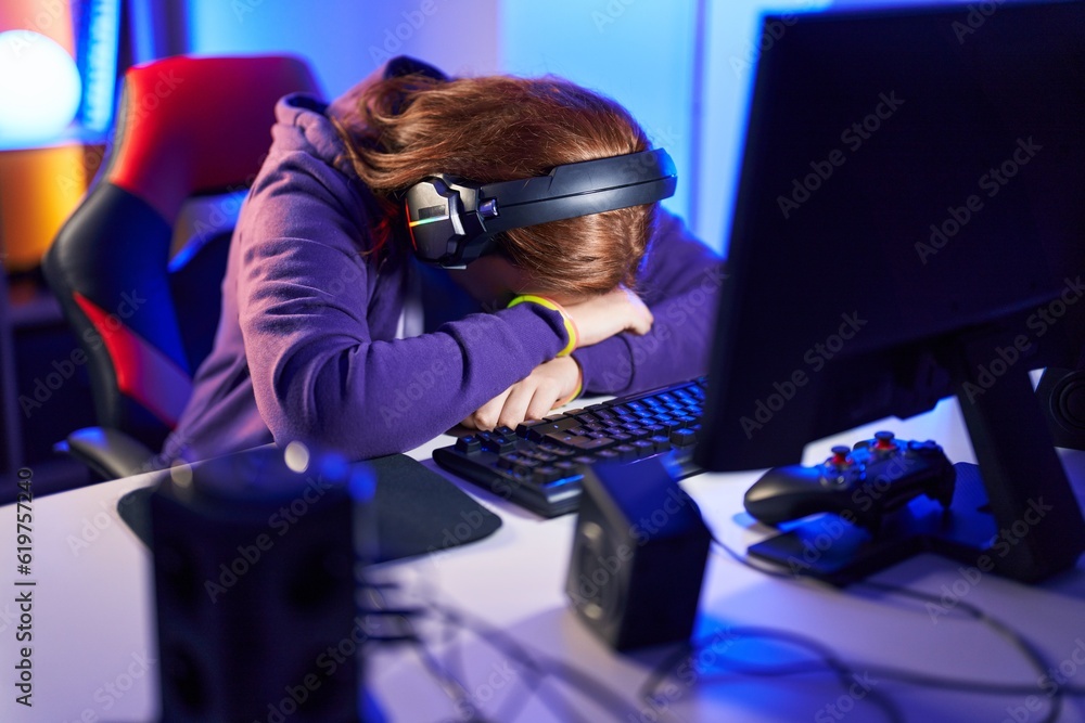 Young beautiful plus size woman streamer stressed using computer at gaming room Young beautiful plus size woman streamer stressed using computer at gaming room