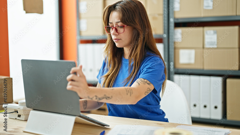Young beautiful hispanic woman ecommerce business worker using laptop working at office Young beautiful hispanic woman ecommerce business worker using laptop working at office