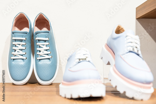 Shelf with fashionable women's shoes in the store