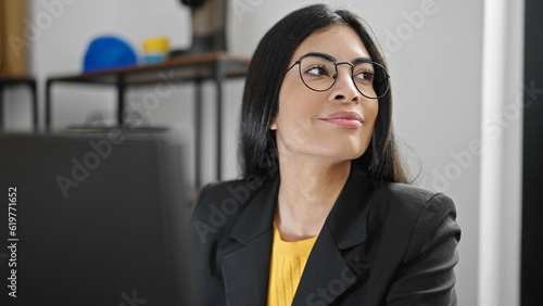 Young beautiful hispanic woman business worker using computer working at office