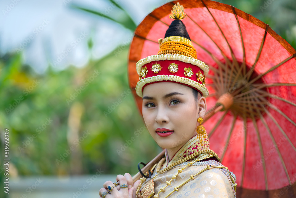 Beautiful Laos girl dressed in ancient luxury national traditional Laos clothes costume. Asian young woman wearing antique traditional Laos Luang Prabang elegantly ethnic clothes culture.