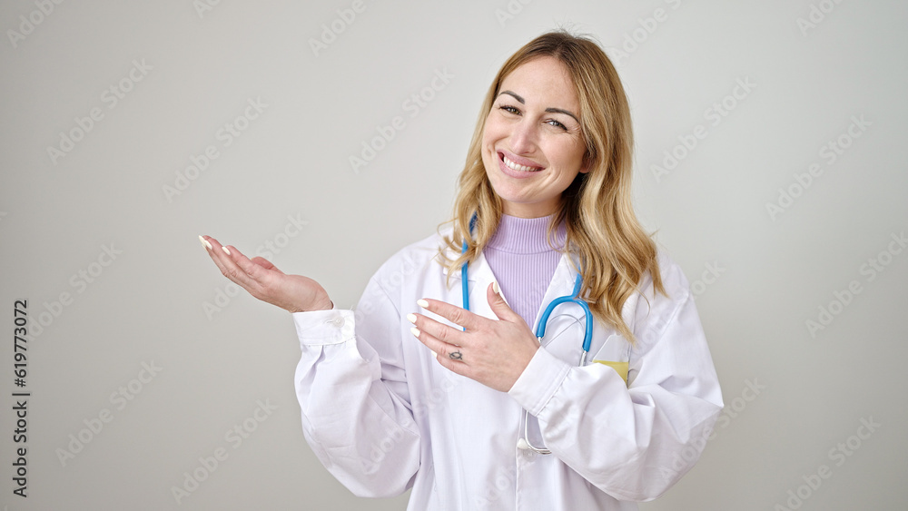 Young beautiful hispanic woman doctor smiling confident presenting over isolated white background Young beautiful hispanic woman doctor smiling confident presenting over isolated white background