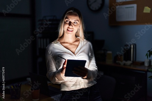 Young woman business worker using touchpad working at office